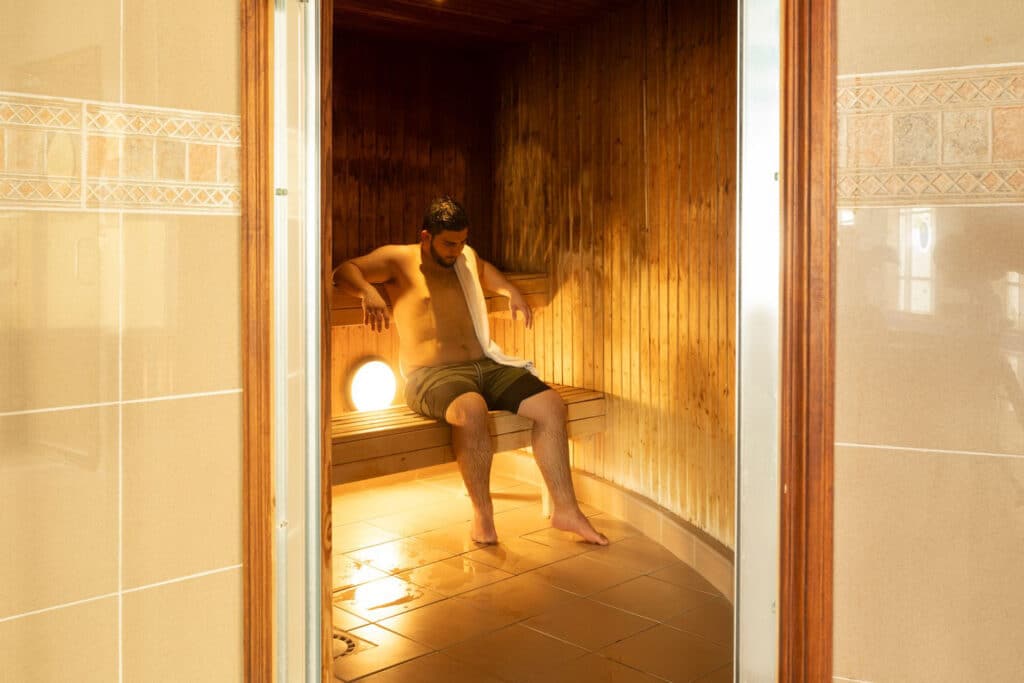 Portrait view of a guy in the sauna room