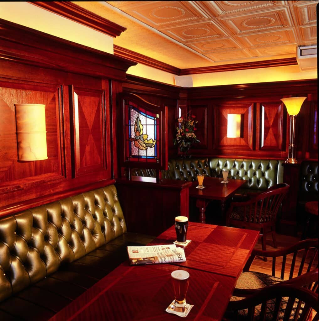 Portrait view of bar with tables with drinks on them at The Seven Oaks Hotel Carlow
