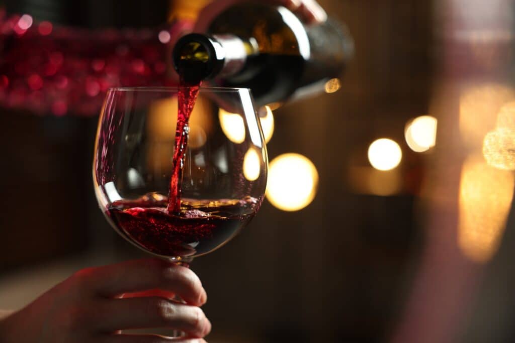 Red wine being poured into a wine glass