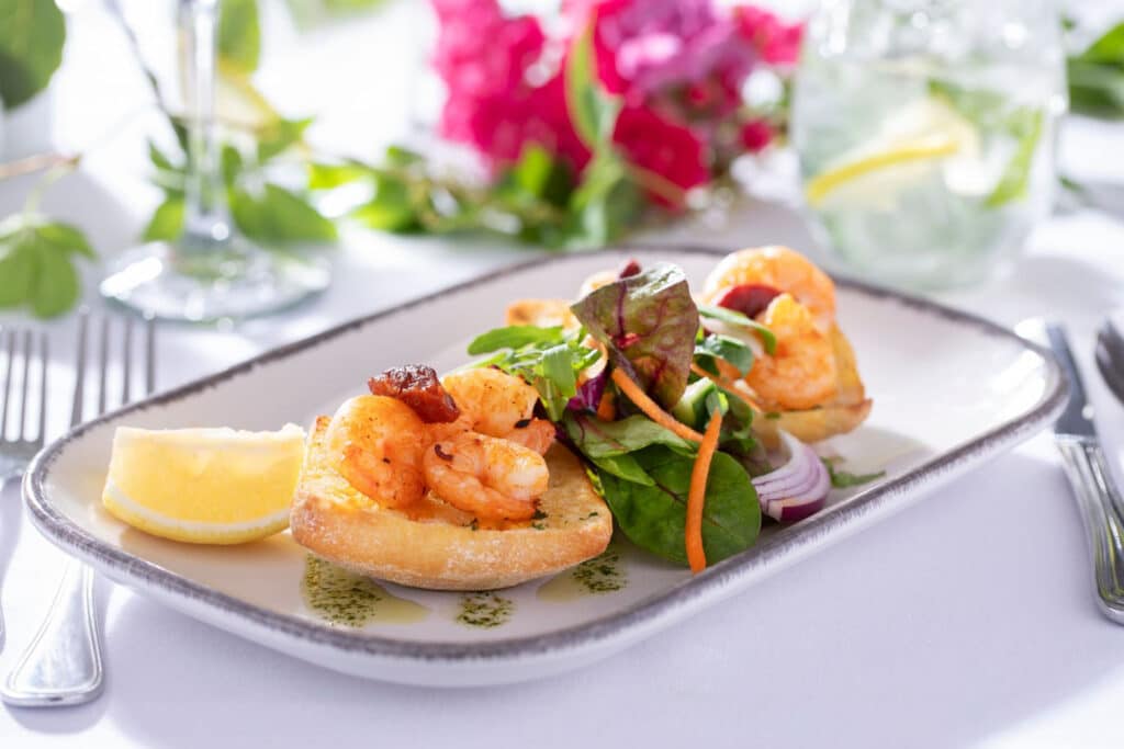 View of prawns on bread with salad food dish