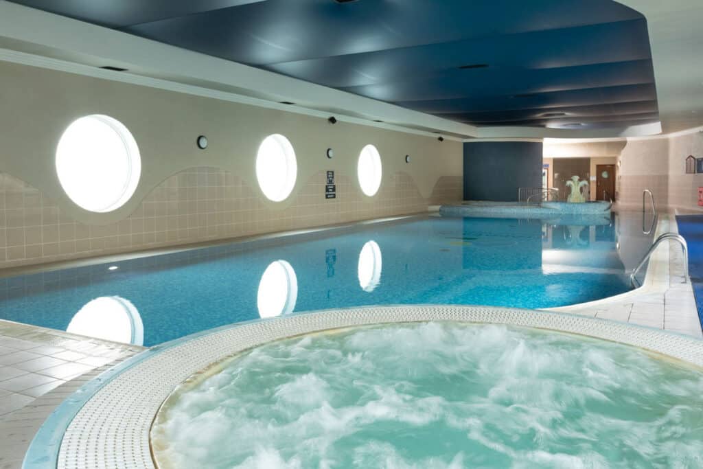 View of the swimming pool with jacuzzi in leisure club